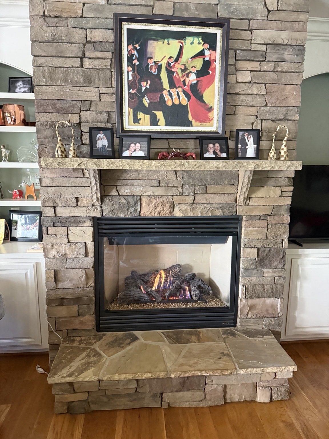 Lennox gas fireplace with stacked stone surround burning cleanly after annual service — Cary, NC